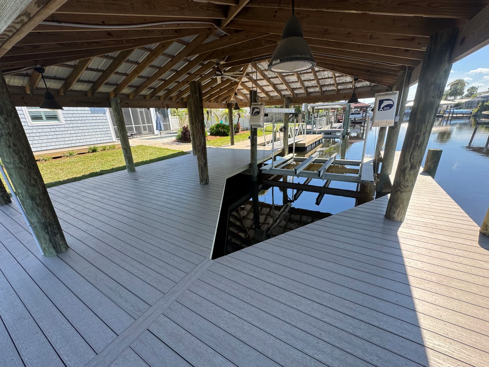 Boat lift under a timber boathouse